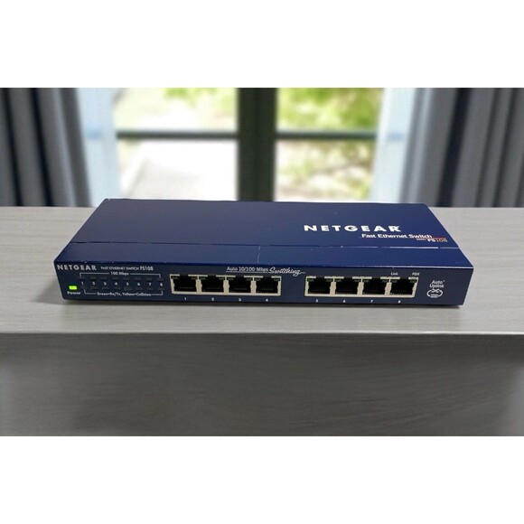 Netgear FS108 8-Port 10/100 Fast Ethernet Switch + Original Power Adapter - Picture 1 of 10